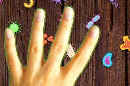 Hand protected with clean:touch touching a table with germs Hand protected with clean:touch touching a table with germs